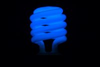 Flickering Blue Fluorescent Light Bulb In Dark Room Against Black intended for size 1920 X 1080