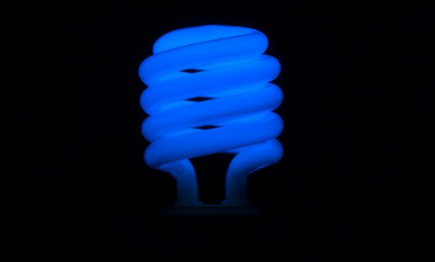 Flickering Blue Fluorescent Light Bulb In Dark Room Against Black intended for size 1920 X 1080