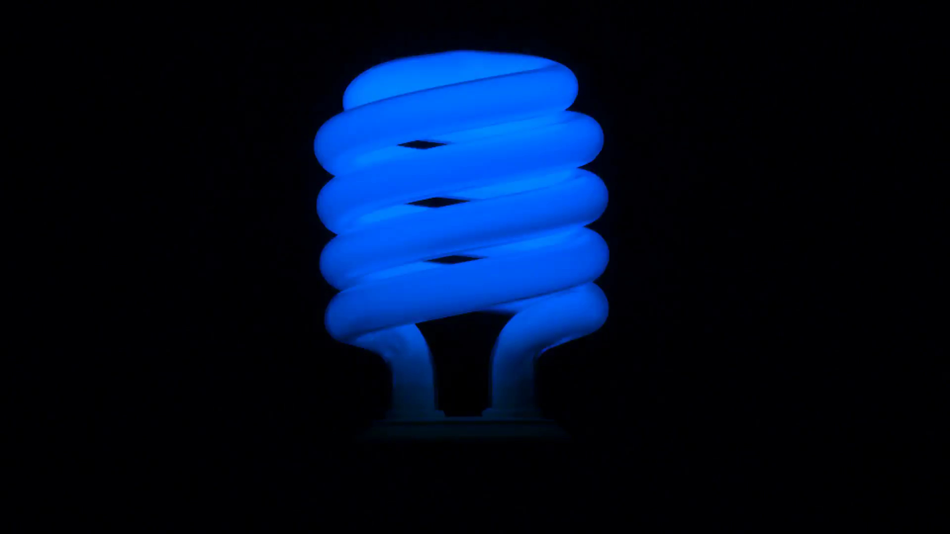 Flickering Blue Fluorescent Light Bulb In Dark Room Against Black intended for size 1920 X 1080