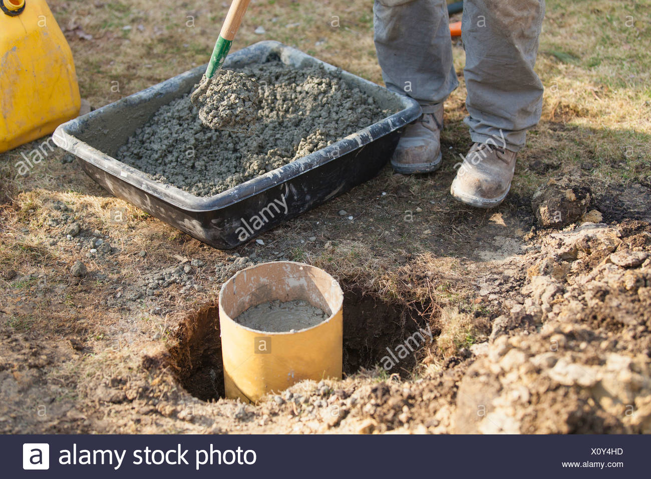 Hispanic Carpenter Mixing Cement For Deck Footing Stock Photo inside sizing 1300 X 956