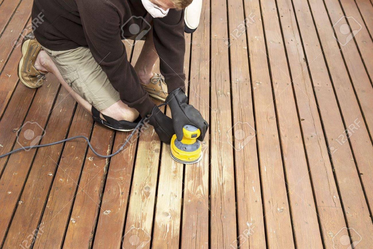 Horizontal Photo Of Mature Man Kneeling While Sanding Outdoor with regard to sizing 1300 X 866