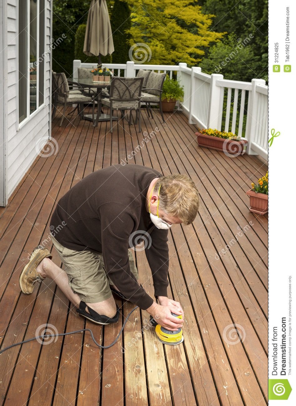 Mature Man Working On Natural Cedar Deck Stock Image Image Of in sizing 948 X 1300