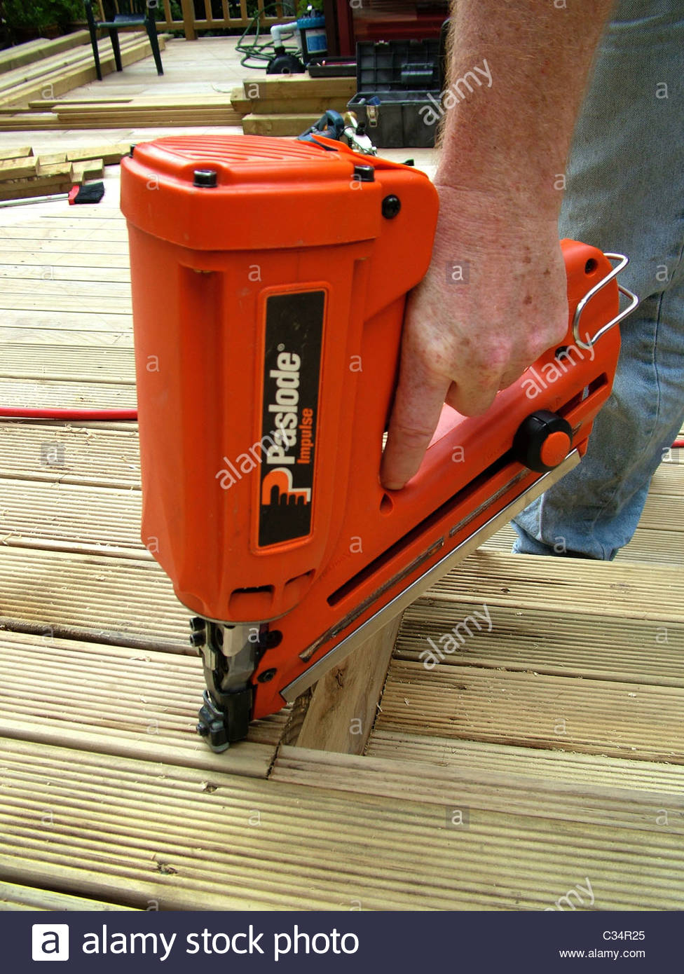 Nailing Decking Hand Holding Paslode Nail Gun Framing Gun Stock within proportions 976 X 1390