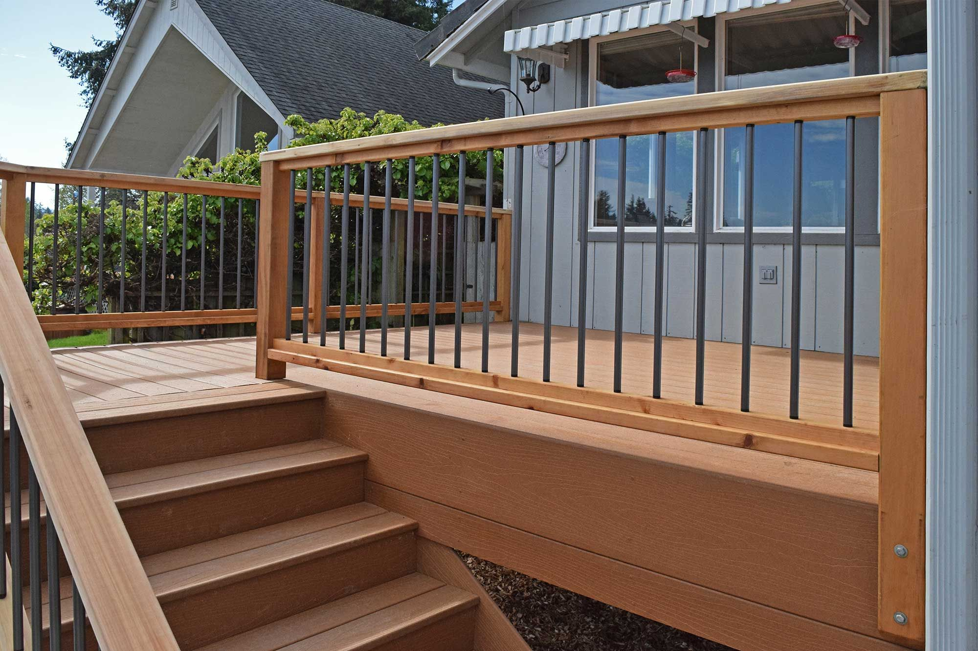 The Railings On This Composite Deck Use Thin Metal Slats To Add for dimensions 2000 X 1333