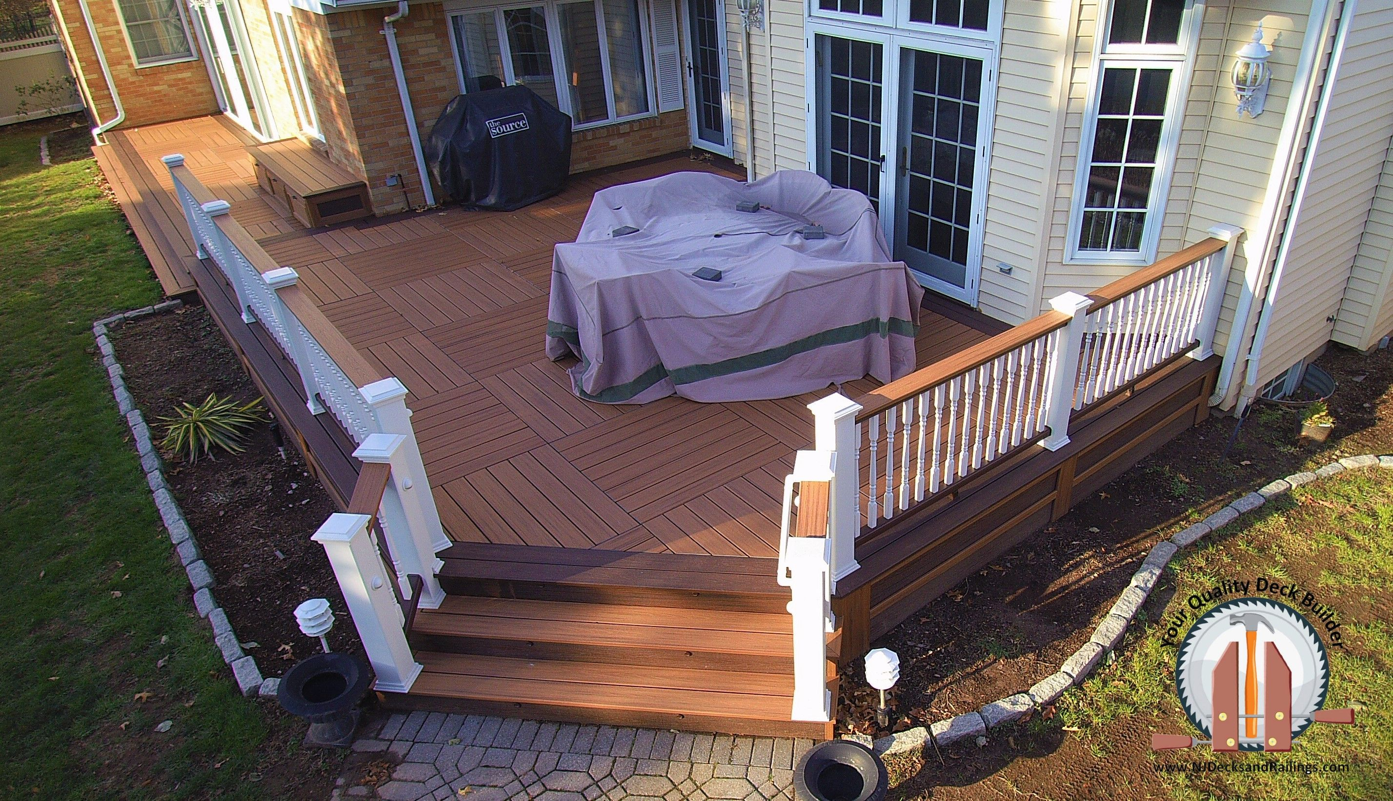 Trex Transcend Tiki Torch Decking With A Lava Rock Border In A pertaining to sizing 2855 X 1643