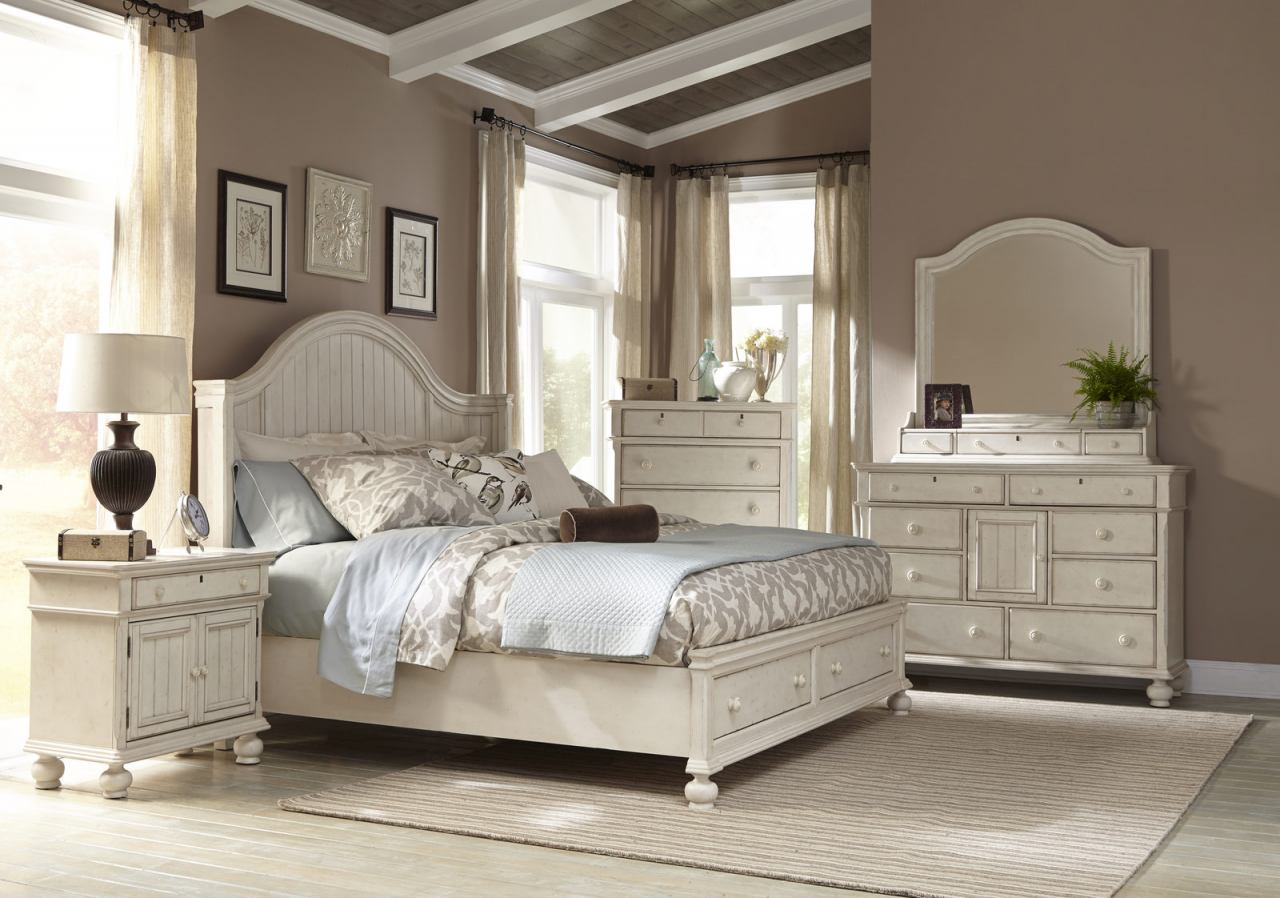 American Woodcrafters Newport 4 Piece Panel Bedroom Set W Storage Footboard In Antique White with regard to proportions 1280 X 898