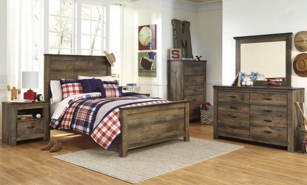 Trinell 4 Piece Panel Bedroom Set In Warm Rustic Oak in proportions 1279 X 874