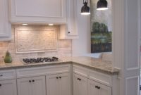 Kitchen With Off White Cabinets Stone Backsplash And Bronze within proportions 925 X 1210